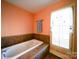 Relaxing bathroom with a garden tub and tile surround at 148 Tetbury Ne Ave, Concord, NC 28025