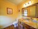 Small bathroom with granite vanity and a large mirror at 148 Tetbury Ne Ave, Concord, NC 28025