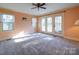 Spacious bedroom with neutral walls, carpeting, and access to deck at 148 Tetbury Ne Ave, Concord, NC 28025