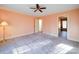 Large bedroom with neutral walls, carpet, and access to bathroom at 148 Tetbury Ne Ave, Concord, NC 28025