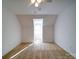 Bright bedroom with dormer window and ceiling fan at 148 Tetbury Ne Ave, Concord, NC 28025