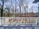 Deck overlooking a fenced backyard and wooded area at 148 Tetbury Ne Ave, Concord, NC 28025