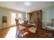 Sunlit dining room featuring hardwood floors and a built-in hutch at 148 Tetbury Ne Ave, Concord, NC 28025