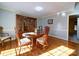 Sunlit dining room with hardwood floors and built-in hutch at 148 Tetbury Ne Ave, Concord, NC 28025