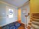 Entryway with hardwood floors, stairs, and a decorative rug at 148 Tetbury Ne Ave, Concord, NC 28025