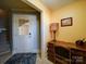 Bright entryway with built-in desk, downstairs access, and neutral color palette at 148 Tetbury Ne Ave, Concord, NC 28025