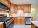 Kitchen with stainless steel appliances and wood cabinets at 148 Tetbury Ne Ave, Concord, NC 28025