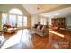 Open living room and dining area with hardwood floors and natural light at 148 Tetbury Ne Ave, Concord, NC 28025