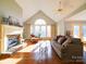 Bright living room with vaulted ceiling, fireplace and hardwood floors at 148 Tetbury Ne Ave, Concord, NC 28025