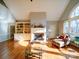 Living room features hardwood floors, built-in shelving, and a fireplace at 148 Tetbury Ne Ave, Concord, NC 28025