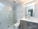 Bright bathroom featuring a glass enclosed shower, modern vanity and minimalist design at 1509 B Briar Creek Rd, Charlotte, NC 28205