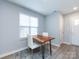 Cozy dining area with a rustic wooden table, bright natural light, and modern decor at 1509 B Briar Creek Rd, Charlotte, NC 28205