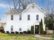 Charming two-story home featuring a black front door and a well-manicured lawn at 1509 Briar Creek Rd # B, Charlotte, NC 28205