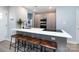 Modern kitchen features a stylish island with seating and stainless steel appliances at 1509 B Briar Creek Rd, Charlotte, NC 28205