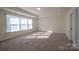 Bright bedroom with neutral carpeting and large windows at 1540 Striped Bass Ln, Clover, SC 29710