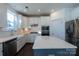 Modern kitchen with island, stainless steel appliances, and white cabinets at 1540 Striped Bass Ln, Clover, SC 29710