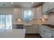 Kitchen features white cabinets, farmhouse sink, and stainless steel appliances at 1540 Striped Bass Ln, Clover, SC 29710