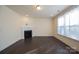 Living room with corner fireplace and hardwood floors at 1540 Striped Bass Ln, Clover, SC 29710