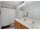 Bathroom with double vanity, shower, and wood cabinets at 1550 Maypine Commons Way, Rock Hill, SC 29732