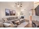 Open living room featuring vaulted ceiling, hardwood floors, and a cozy fireplace at 1550 Maypine Commons Way, Rock Hill, SC 29732