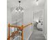 Upstairs hallway with a view of a bedroom and chandelier at 1550 Maypine Commons Way, Rock Hill, SC 29732