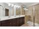 Bathroom boasts double vanity, large shower and tile flooring at 16341 Autumn Cove Ln, Huntersville, NC 28078