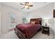 Bedroom with private balcony access and a ceiling fan at 16341 Autumn Cove Ln, Huntersville, NC 28078