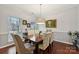 Formal dining room with hardwood floors and a chandelier at 16341 Autumn Cove Ln, Huntersville, NC 28078