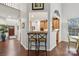 Kitchen breakfast bar with two chairs, view of kitchen and entryway at 16341 Autumn Cove Ln, Huntersville, NC 28078