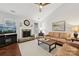 Spacious living room with a stone fireplace and hardwood floors at 16341 Autumn Cove Ln, Huntersville, NC 28078