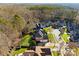 Aerial view of a beautiful home and surrounding neighborhood with lush trees at 18621 Rollingdale Ln, Davidson, NC 28036