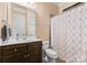 Clean bathroom with shower/tub combo and updated vanity at 18621 Rollingdale Ln, Davidson, NC 28036