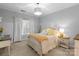 Lovely bedroom with yellow bedding, soft lighting, and a writing desk at 18621 Rollingdale Ln, Davidson, NC 28036