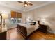 Bright bedroom with hardwood floors and a charming window at 18621 Rollingdale Ln, Davidson, NC 28036