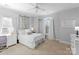 Charming bedroom with white furniture, leafy decor, and a workspace at 18621 Rollingdale Ln, Davidson, NC 28036