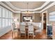 Elegant dining room featuring hardwood floors, a chandelier, and wainscoting at 18621 Rollingdale Ln, Davidson, NC 28036