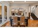 Bright dining room with hardwood floors and access to the kitchen at 18621 Rollingdale Ln, Davidson, NC 28036