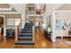 Elegant two-story entryway with hardwood floors, a grand staircase, and lots of natural light at 18621 Rollingdale Ln, Davidson, NC 28036