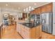 Spacious kitchen boasts an island, stainless steel appliances, and hardwood floors at 18621 Rollingdale Ln, Davidson, NC 28036