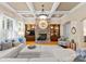 Spacious living room features a stone fireplace, built-in shelving, and hardwood floors at 18621 Rollingdale Ln, Davidson, NC 28036