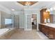 Luxurious en-suite bathroom with soaking tub and walk-in shower at 18621 Rollingdale Ln, Davidson, NC 28036