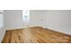 Light-filled bedroom with wood floors and en-suite bath at 203 Linwood Rd, Kings Mountain, NC 28086