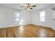 Well-lit bedroom with hardwood floors, ceiling fan and windows at 203 Linwood Rd, Kings Mountain, NC 28086