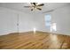 Spacious bedroom with hardwood floors, ceiling fan, and window at 203 Linwood Rd, Kings Mountain, NC 28086