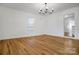 Bright dining room with hardwood floors and chandelier at 203 Linwood Rd, Kings Mountain, NC 28086