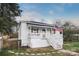 White bungalow with a porch, steps, and American flag at 203 Linwood Rd, Kings Mountain, NC 28086