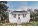 Charming white bungalow with front porch and steps at 203 Linwood Rd, Kings Mountain, NC 28086