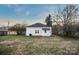 Rear view of the house showing backyard and landscaping at 203 Linwood Rd, Kings Mountain, NC 28086