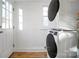 Bright laundry room, washer, dryer, and exterior access at 203 Linwood Rd, Kings Mountain, NC 28086