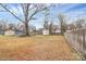 Large backyard offering ample space for outdoor activities featuring a storage shed at 208 Lakewood Ave, Charlotte, NC 28208